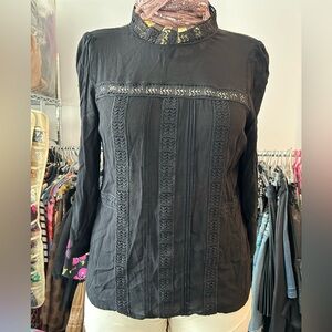 HM crepe top with lacs trim along center front and at neck edge